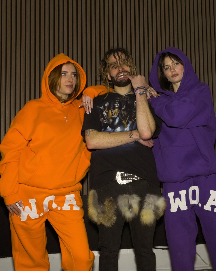El Presco with two female models wearing his brand "War On Art" (WOA)